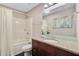Bathroom features a tub-shower combo, wood vanity, and modern fixtures at 316 Simmons Ave, Summerville, SC 29483