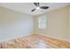 Bright bedroom with hardwood floors, ceiling fan and a window overlooking the neighborhood at 316 Simmons Ave, Summerville, SC 29483