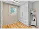 Bedroom features a built-in wardrobe, natural light, and beautiful wood floors at 316 Simmons Ave, Summerville, SC 29483