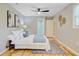 A well-furnished bedroom leads to a bathroom and showcases stylish wall decor and ample natural light at 316 Simmons Ave, Summerville, SC 29483