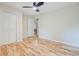 Bright bedroom with hardwood floors, ceiling fan, closet and white door at 316 Simmons Ave, Summerville, SC 29483