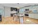 Inviting dining area with modern decor, hardwood floors, stainless appliances and lots of sunshine at 316 Simmons Ave, Summerville, SC 29483