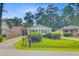 Quaint home with neat landscaping and a charming facade, set in a peaceful neighborhood at 316 Simmons Ave, Summerville, SC 29483