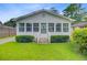 Cozy home featuring a welcoming front porch, well-kept lawn, and classic architectural details at 316 Simmons Ave, Summerville, SC 29483