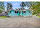 Beautifully updated home with a large driveway, vibrant color and inviting front porch at 316 Simmons Ave, Summerville, SC 29483