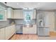 Bright kitchen featuring stainless steel appliances, hardwood floors, and granite countertops at 316 Simmons Ave, Summerville, SC 29483