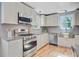 Well-equipped kitchen featuring stainless steel appliances, cabinetry and ample counter space at 316 Simmons Ave, Summerville, SC 29483