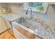 Close up of a kitchen sink with granite countertops and stainless faucet fixture at 316 Simmons Ave, Summerville, SC 29483