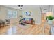 Cozy living room featuring hardwood floors, stylish decor, and ample natural light at 316 Simmons Ave, Summerville, SC 29483
