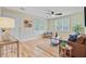 Bright living room with hardwood floors, large windows, and comfortable seating at 316 Simmons Ave, Summerville, SC 29483