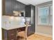 Dedicated home office space featuring built-in cabinetry, desk, and a window for natural light at 316 Simmons Ave, Summerville, SC 29483