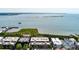 Stunning aerial view of 32 Prioleau with waterfront, landscaping, and nearby pier at 32 Prioleau St # J, Charleston, SC 29401