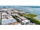 Stunning aerial view of the city, marina, and waterfront, perfect for relaxed living at 32 Prioleau St # J, Charleston, SC 29401