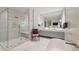 Bathroom features a large shower, soaking tub, double sinks, and lots of white marble tile at 32 Prioleau St # J, Charleston, SC 29401