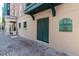 Exterior of building at One Vendue Range with address number 32 and brick-paved street at 32 Prioleau St # J, Charleston, SC 29401