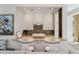 Kitchen pass-through featuring white cabinetry and a marble countertop with seating at 32 Prioleau St # J, Charleston, SC 29401