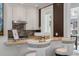 Kitchen pass-through featuring white cabinetry and a marble countertop with seating at 32 Prioleau St # J, Charleston, SC 29401