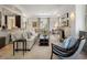 Spacious living room featuring an open layout with a fireplace, comfortable seating, and stylish decor at 32 Prioleau St # J, Charleston, SC 29401