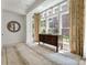 Spacious office featuring large windows, a decorative wooden desk, and designer finishes at 32 Prioleau St # J, Charleston, SC 29401