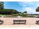 Beautiful park fountain surrounded by manicured greenery and benches under a clear sky at 32 Prioleau St # J, Charleston, SC 29401