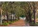 Charming park path lined with mature trees leading to an elegant water fountain at 32 Prioleau St # J, Charleston, SC 29401