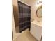 Bathroom features a white vanity and a shower with a dark curtain at 3347 Walter Drive, Johns Island, SC 29455