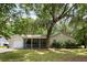 Charming single-story home with a covered porch, lush lawn, and a mature, shade-providing tree at 3347 Walter Drive, Johns Island, SC 29455