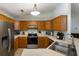 Functional kitchen with wooden cabinets, stainless steel appliances, and a view to the living area at 3347 Walter Drive, Johns Island, SC 29455