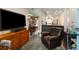 Comfortable seating area with a large TV, built-in hot tub, and tiled floors for relaxation and entertainment at 3347 Walter Drive, Johns Island, SC 29455
