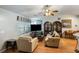 Cozy living room with hardwood floors, neutral walls, large window, and a glimpse into the dining area at 3347 Walter Drive, Johns Island, SC 29455