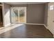 Open-concept living space with sliding glass doors and wood-look flooring at 3347 Walter Drive, Johns Island, SC 29455