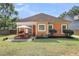 Lovely backyard showcasing an outdoor dining area with patio and well-maintained lawn at 350 Cypress Walk Way, Wando, SC 29492