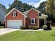 Charming single-story home with a manicured lawn, two-car garage and inviting front entrance at 350 Cypress Walk Way, Wando, SC 29492