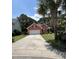 Charming single-story home with an attached two-car garage, beautiful landscaping, and a long driveway at 350 Cypress Walk Way, Wando, SC 29492