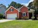 Charming single-Gathering home featuring a two-car garage, manicured lawn, and inviting entrance at 350 Cypress Walk Way, Wando, SC 29492