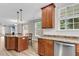 Bright kitchen with stainless steel appliances, granite countertops, and a functional island at 350 Cypress Walk Way, Wando, SC 29492