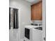 Functional laundry area with washer, dryer, cabinets and exterior door at 350 Cypress Walk Way, Wando, SC 29492