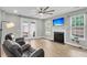 Comfortable living room featuring a fireplace and access to outdoor patio at 350 Cypress Walk Way, Wando, SC 29492