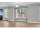Open-concept living area with lots of natural light and modern flooring throughout at 350 Cypress Walk Way, Wando, SC 29492