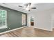 Inviting bedroom with large windows and adjacent bath at 350 Cypress Walk Way, Wando, SC 29492