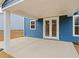 Back patio featuring concrete floor, tall support columns, and blue siding at 353 Wappoo Trace Ln, Summerville, SC 29486