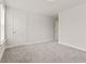 Bright bedroom with neutral walls, carpet, and doorway leading to another room at 353 Wappoo Trace Ln, Summerville, SC 29486