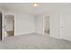 Bright bedroom with neutral walls, carpet, and doorways leading to other rooms at 353 Wappoo Trace Ln, Summerville, SC 29486