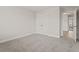 Bright bedroom with neutral walls, carpet, and doors leading to other rooms at 353 Wappoo Trace Ln, Summerville, SC 29486
