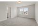 Bright bedroom with neutral walls, carpet, and doorway leading to bathroom at 353 Wappoo Trace Ln, Summerville, SC 29486