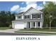 Charming two-story home with a manicured lawn, attached garage, and classic curb appeal at 353 Wappoo Trace Ln, Summerville, SC 29486