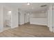 Open upstairs loft area with hardwood floors, offers flexible living space with multiple doorways at 353 Wappoo Trace Ln, Summerville, SC 29486