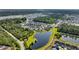Aerial view showcases a residential area with serene pond, mature trees and meticulously landscaped surroundings at 3537 Crosstrees Ln, Mount Pleasant, SC 29466