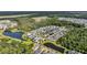 An aerial perspective of a lovely community with houses arranged around a scenic pond and baseball field at 3537 Crosstrees Ln, Mount Pleasant, SC 29466