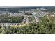 Aerial view of the residential area showcasing the community layout, lush greenery, and lakes at 3537 Crosstrees Ln, Mount Pleasant, SC 29466